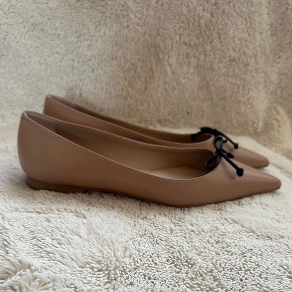 Stuart Weitzman Nude Tan Pointed Toe Ballet Flats with Black Bow